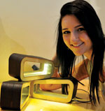 Tanya Smit, winner of the Student category, with her 
Tri-Lum Luminaire.